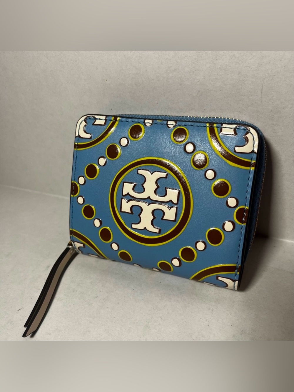 Tory Burch monogram embossed bi-fold wallet